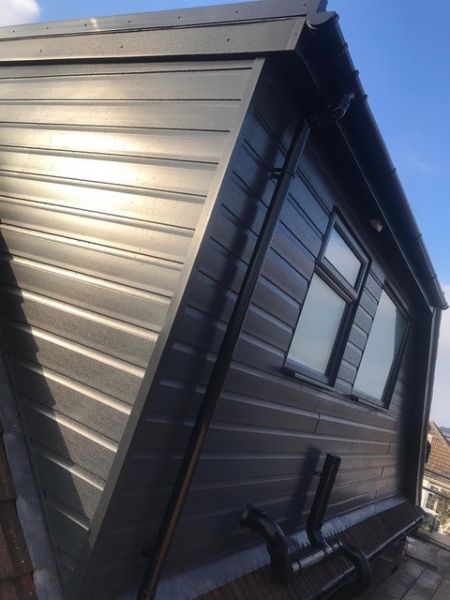 Anthracite grey UPVC cladded Flat roof dormer.: Swipe To View More Images