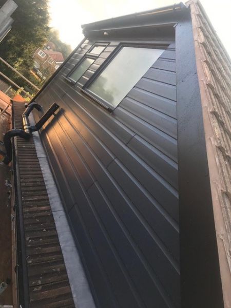 Anthracite grey UPVC cladded flat roof dormer.: Swipe To View More Images