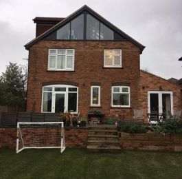 floor to ceiling Glass gable end loft conversion with side pitched roof dormer to accommodate the new staircase.: Click Here To View Larger Image
