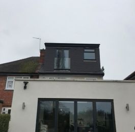 Flat roof dormer with smooth grey plain concrete hanging tiles.: Click Here To View Larger Image