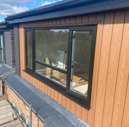 Flat roof dormer, vertical composite cedar cladding.: Click Here To View Larger Image